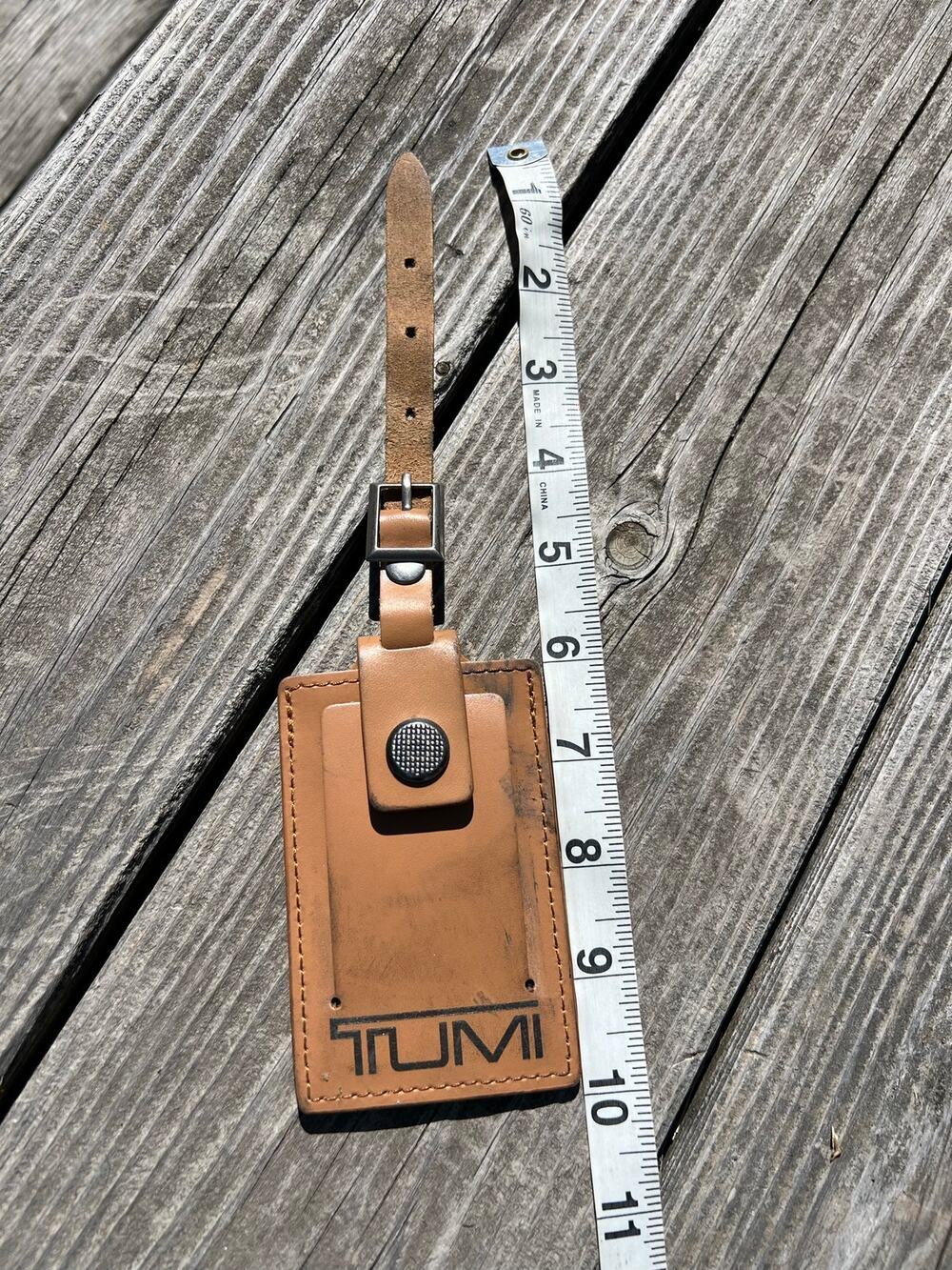 Tumi luggage tan leather bag tag travel identification ID belt briefcase logo